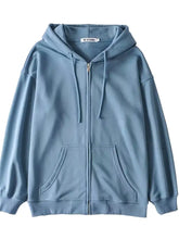 Casual loose zip-up hoodie in soft light blue with drawstring hood and front pockets machine wash cold recommended