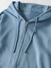 Light blue casual loose zip-up hoodie with matching drawstrings and subtle textured lining machine wash cold