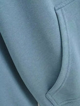 Casual loose zip-up hoodie with a soft light blue fleece pocket and ribbed hem, machine wash cold recommended