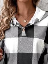 Black and white checkered long-sleeved casual plaid button detail hoodie with collar and button closure machine wash cold