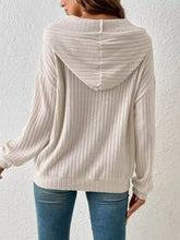 Beige ribbed knit drawstring hoodie with cozy relaxed fit and soft texture machine wash cold recommended