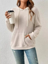 Cream-colored casual ribbed knit drawstring hoodie with front pocket made from machine wash cold fabric
