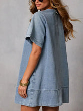 Light blue short sleeve denim dress with flutter sleeves and relaxed fit perfect for casual wear