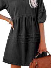 Black denim mini dress with v-neck, three-quarter puff sleeves, and tiered hemline for casual wear