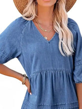 Blue denim mini dress with v-neckline puff sleeves and tiered skirt perfect for casual wear