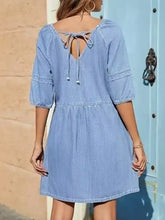 Light blue denim mini dress with back tie detail and three quarter puff sleeves for casual wear
