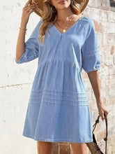 Light blue denim mini dress with puffed sleeves and tiered skirt casual v neck denim mini dress