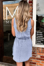 A light blue denim mini dress with a scoop neck and gathered waistband casual washed style