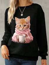 Black cat in pink sweater holding mug on round neck long sleeve sweatshirt