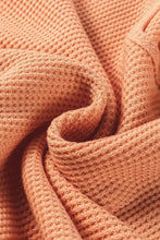 Peach V-neck long sleeve waffle knit top with ribbed cuffs and stretchy cozy fabric