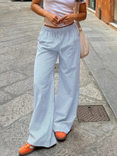Light blue and white striped drawstring wide leg pants with elastic waistband for comfortable everyday wear