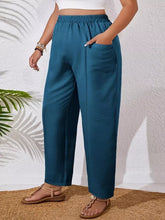 Plus size teal casual pants with relaxed fit, elastic waistband, front pockets, and soft fabric blend for ultimate comfort