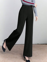 Black high-waisted wide leg pants with a sleek tailored fit perfect for formal and office wear