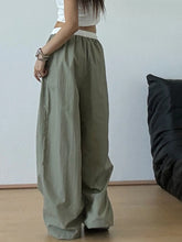 Olive green wide leg drawstring casual pants with white elastic waistband for comfortable everyday wear