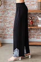 Black wide-leg heimish full size solid damask casual pants with high-waisted elastic and white embroidered cuffs