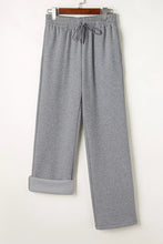 Gray heathered drawstring loose fit pants with elastic waistband and rolled cuffs for comfortable wear