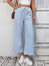 Light blue and white striped wide leg pants with a drawstring waistband for comfortable casual wear