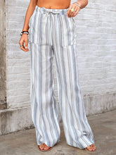 Full size striped wide leg pants in light blue and gray vertical stripes with drawstring waistband and front pockets