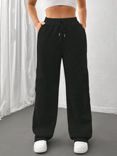 Black relaxed fit drawstring waist wide-leg sweatpants with side pockets for casual comfort