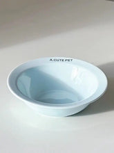Light blue ceramic pet bowl with glossy finish and a.cute pet text