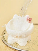 White ceramic pet bowl with pink bowknot and slanted interior