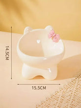 White ceramic pet bowl shaped like cat with pink bowknot