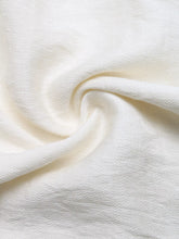 Soft off-white cotton wide leg pants with pockets featuring a subtle textured weave for a perfect fit and comfort