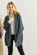 Young woman in Adora popcorn knit long sleeve cardigan with pockets