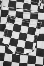 Checkerboard print black and white checkered denim pocket with contrasting stitching and distressed details on cropped jeans