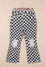 Black and white checkerboard print denim flare pants with distressed details raw edges and cropped fit