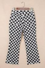 Black and white checkerboard print flared jeans featuring distressed details and raw edges with frayed hems