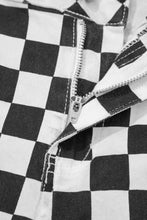 Checkerboard print distressed details raw edge cropped black and white denim jeans with silver zipper closure