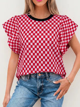 Checkered print ruffle top with red and white checkered print and black contrast trim round neck with ruffle cap sleeve