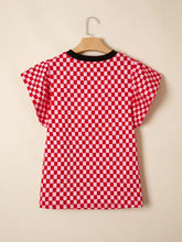 Checkered print ruffle cap sleeve top in red and white with black ribbed crew neck short sleeves