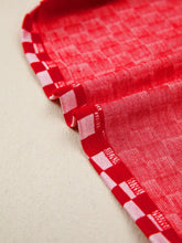 Red and white checkered print ruffle cap sleeve top with woven texture and contrast trim round neck design