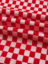 Red and white checkered print ruffle cap sleeve top with woven texture and contrast trim round neck design
