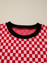 Red and white checkered print ruffle cap sleeve cotton t-shirt with black ribbed crew neck and contrast trim round neck top