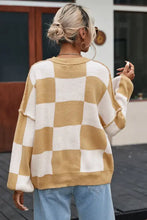Checkered ribbed knit sweater in mustard beige and white with oversized sleeves
