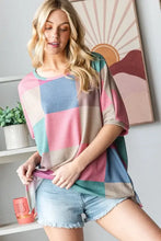 Women’s checkered round neck slit t-shirt in colorful patchwork waffle knit
