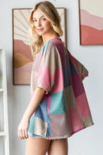 Woman in checkered round neck slit t-shirt design, colorful patchwork top