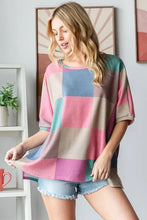 Women’s checkered round neck slit t-shirt with pastel stripes
