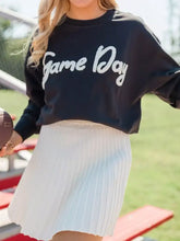 Black chenille game day drop shoulder sweatshirt with white cursive lettering and long sleeves, machine wash safe