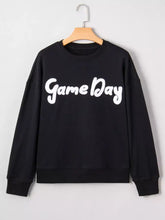 Black chenille game day drop shoulder sweatshirt with white cursive lettering, machine wash friendly