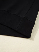 Black ribbed knit cuff of chenille game day drop shoulder sweatshirt designed for casual machine wash wear