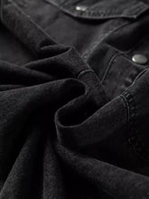 Black raw hem denim shirt dress with chest pocket featuring rugged texture and silver-toned buttons