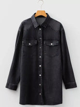 Black denim raw hem shirt dress with chest pockets silver buttons and loose fit design