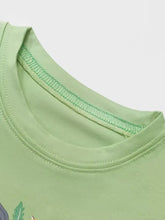 Light green children’s animal crew neck t-shirt with embroidered leaf. Machine wash cold