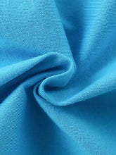 Vibrant blue bus embroidery fabric on kids t-shirt, machine wash cold