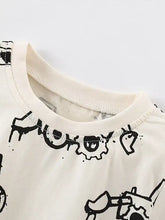 Children’s excavator print cream t-shirt with cartoon gears, machine wash cold
