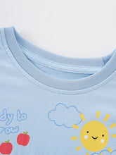 Light blue childrens cartoon farm print t-shirt with smiling sun, clouds, apples. Machine wash cold